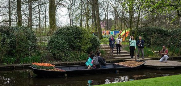 Flower garden, Netherlands , a group of people in a boat on a ri © SkandaRamana - stock.adobe.com